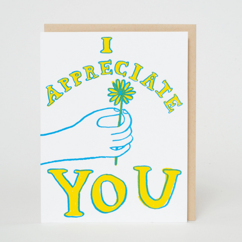 Greeting card with 'I appreciate you' text and a hand holding a flower on a white background.