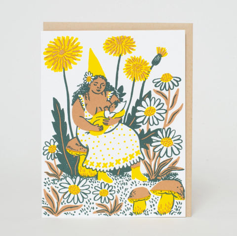 Greeting card with a colorful illustration of a woman holding a baby surrounded by flowers and plants.
