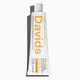 Tube of Davids toothpaste on a white background