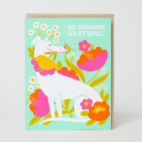 Greeting card with a dog and floral design on a light green background