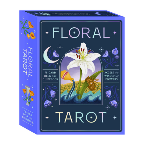 A boxed tarot card deck called Floral Tarot, shown at a slight angle to display both the front cover art and the spine. The box is predominantly a vivid periwinkle blue with a dark navy front panel featuring an illustration of a white lily, a crescent moon, stars, and small floral motifs.