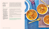 A printed recipe card for Silty Sweet Potato Bisque shown on a styled tabletop with bowls of food, a spoon, and a striped napkin. The card includes the title, ingredients, and numbered preparation instructions.