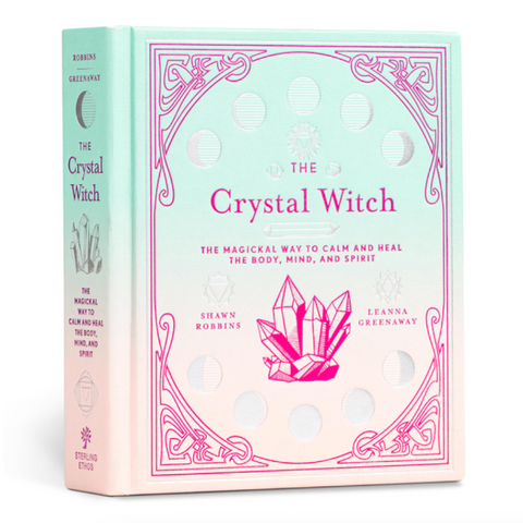 Book titled 'The Crystal Witch' with crystal graphics on a light green and pink background