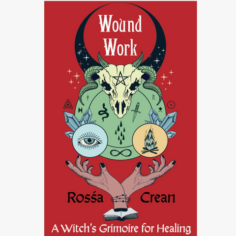 Book cover for 'Wound Work: A Witch's Grimoire for Healing' by Rossá Crean, featuring a red background with a central illustration of a goat skull, green snake, blue eye, crystal, and hands holding an inkwell and quill.