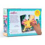 eefo axolotl puzzle packaging with a hand holding a piece