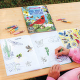 Coloring book titled 'Bugs, Birds & Butterflies' on a table with coloring pages and crayons.