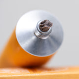 Close-up of exfoliant in a tube on a light background